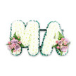 The photograph presents an elegant funeral flower arrangement spelling out the letters MA, designed as a personal tribute that might rest on an easel or coffin at a South Woodford service. Both capital letters are densely packed with crisp white chrysanthemums, each tiny bloom forming a small dome of petals. Together they create a thick, pillow-like surface that looks soft to the touch, conveying comfort and tenderness at a time of grief. The chrysanthemums are fresh and uniform, with subtle variations in petal length that give the letters a natural, living texture rather than a flat, manufactured look. Around the outer edge of each letter runs a narrow yet striking border of dark green ribbon, likely satin or similar fabric, pleated into gentle ruffles. This creates a strong outline that clearly defines the M and the A while echoing the deep greens of the trees lining nearby South Woodford streets. At the base of each letter, the stark white is warmed by small, carefully positioned floral sprays. On the lower left of the M and the lower right of the A, clusters of pastel roses unfold in shades of pale pink and soft lilac, accompanied by delicate pink spray roses and sprigs of mixed foliage. Feathery fern leaves arc gracefully from each grouping, introducing a hint of movement and a slightly wild, garden feel, as if gathered from a quiet corner of a local park. Set against a plain white background with even lighting, every petal, ribbon fold, and leaf vein is clearly visible. The overall effect is of a bespoke sympathy tribute that conveys devotion, gratitude, and enduring love, the kind of thoughtful letter arrangement families in South Woodford might choose when marking a final farewell.