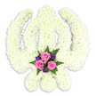 A solemn and striking Sikh Khanda-shaped floral tribute stands out crisply against a bright white background, its sacred form entirely composed of compact white chrysanthemum blossoms. The flowers are arranged so densely that they create a smooth, seamless surface, from the sharp line of the central double-edged sword to the round, protective Chakra and the two curved kirpans crossing gracefully at the base. The petals are a soft, creamy white, their feathery edges catching the light and giving the whole design a gentle, almost glowing presence. At the very bottom centre, tucked within the cradle of the crossed swords, a small, vibrant cluster of coloured blooms adds a poignant focal point. Three pink roses sit at the core, their petals layered in perfect spirals, suggesting tenderness and love. Around them, smaller deep purple flowers, similar to lisianthus or freesias, nestle closely, deepening the colour palette without disturbing the overall purity of the tribute. Wisps of fresh green fern and foliage frame this cluster, their fronds curving lightly over the white chrysanthemums and giving the design a naturally finished edge. The arrangement feels calm, respectful, and carefully measured, as if it has been thoughtfully prepared for a Sikh funeral or memorial for a family from South Woodford, perhaps on their way to a service near the station or along the High Road. This bespoke Khanda tribute, handcrafted by a skilled local florist, offers a serene expression of faith, remembrance, and quiet strength, ideal for honouring a loved one's life and spiritual path within the Sikh community.