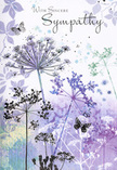 This sympathy card unfolds like a soft, visual poem, as tranquil as a slow walk from South Woodford station towards the green edges of Epping Forest. Airy silhouettes of wildflowers stretch upward from the base of the scene, their stems long and slender, drawn in delicate strokes of lavender, indigo, and muted blue. At their tips, fine umbel-shaped flower heads fan out in intricate patterns, each tiny floret spaced so lightly that the blooms seem to float. Behind them, a dreamlike background of watercolour washes drifts from cool purples into silvery greens and pale blues, echoing distant fields under a hazy sky. Here and there, ghost-soft impressions of foliage and additional flower shapes fade in and out, like memories at the edge of awareness. Among the stems, butterflies are suspended mid-air, their wings only faintly outlined, suggesting transformation, gentle presence, and the idea that love continues beyond what we can see. The lighting is diffuse and tender, with no harsh contrasts, giving the entire design a hushed, contemplative mood. The words of sympathy sit above or beside the flowers in an elegant script, weaving seamlessly into the artwork rather than overpowering it. As a florist serving South Woodford, I recognise how thoughtfully this image has been composed: it mirrors the quiet comfort of a hand-tied sympathy bouquet, offering a respectful embrace for someone grieving, and providing a serene, nature-inspired way to share sincere condolences within the local community.